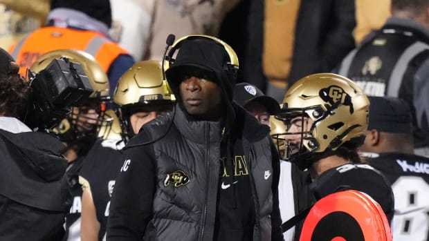 Colorado Buffaloes head coach Deion Sanders walks the sidelines in the second half against the Stanford Cardinal at Folsom Field.
